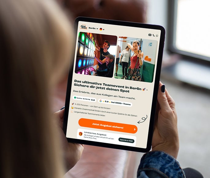 tablet mockup held by user beside a window looking at YourShowdown Website
